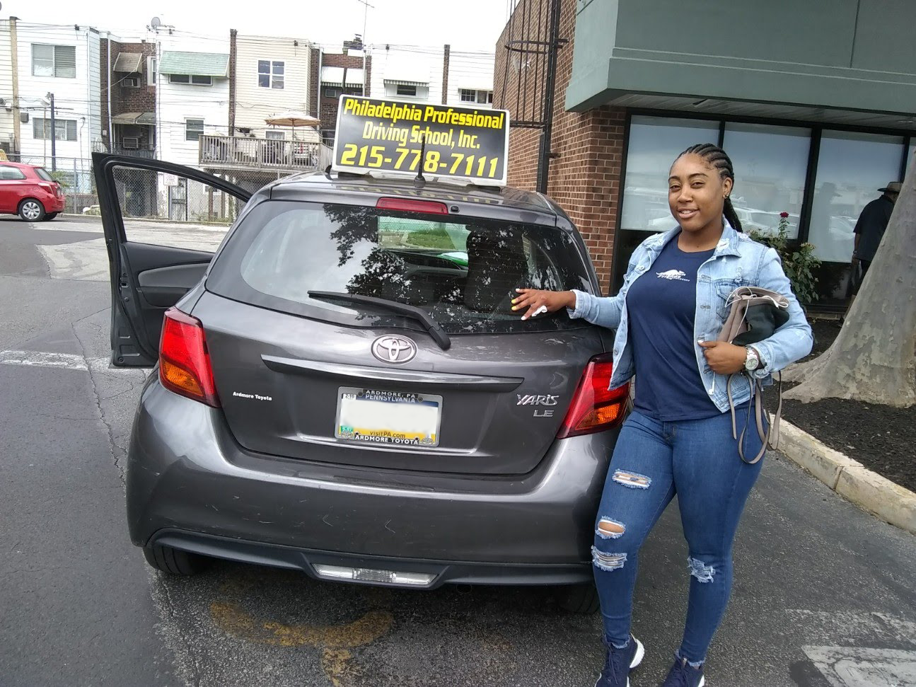 Woman in blue shirt successfully passed driving school test