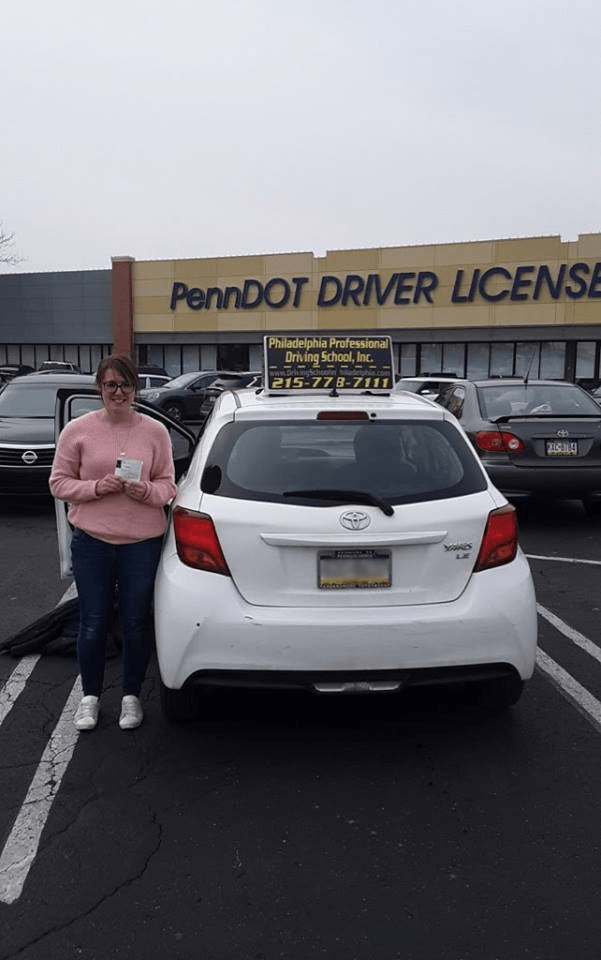 Female in pink sweatshirt successfully passed driving school test
