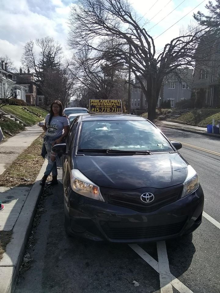 Female holding driver's license