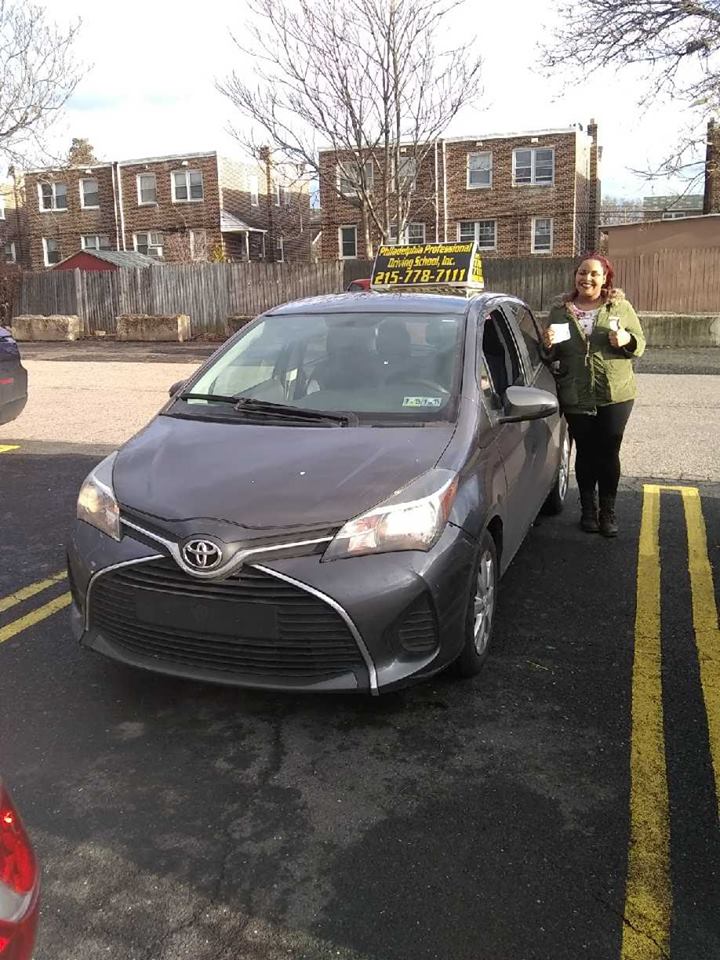 Smiling woman doing ok sign