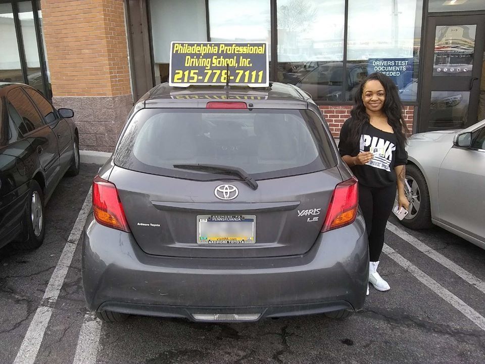 Smiling woman with driver's license