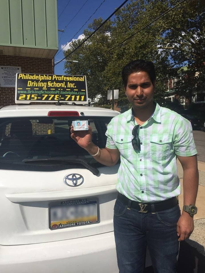 Male holding driver's license