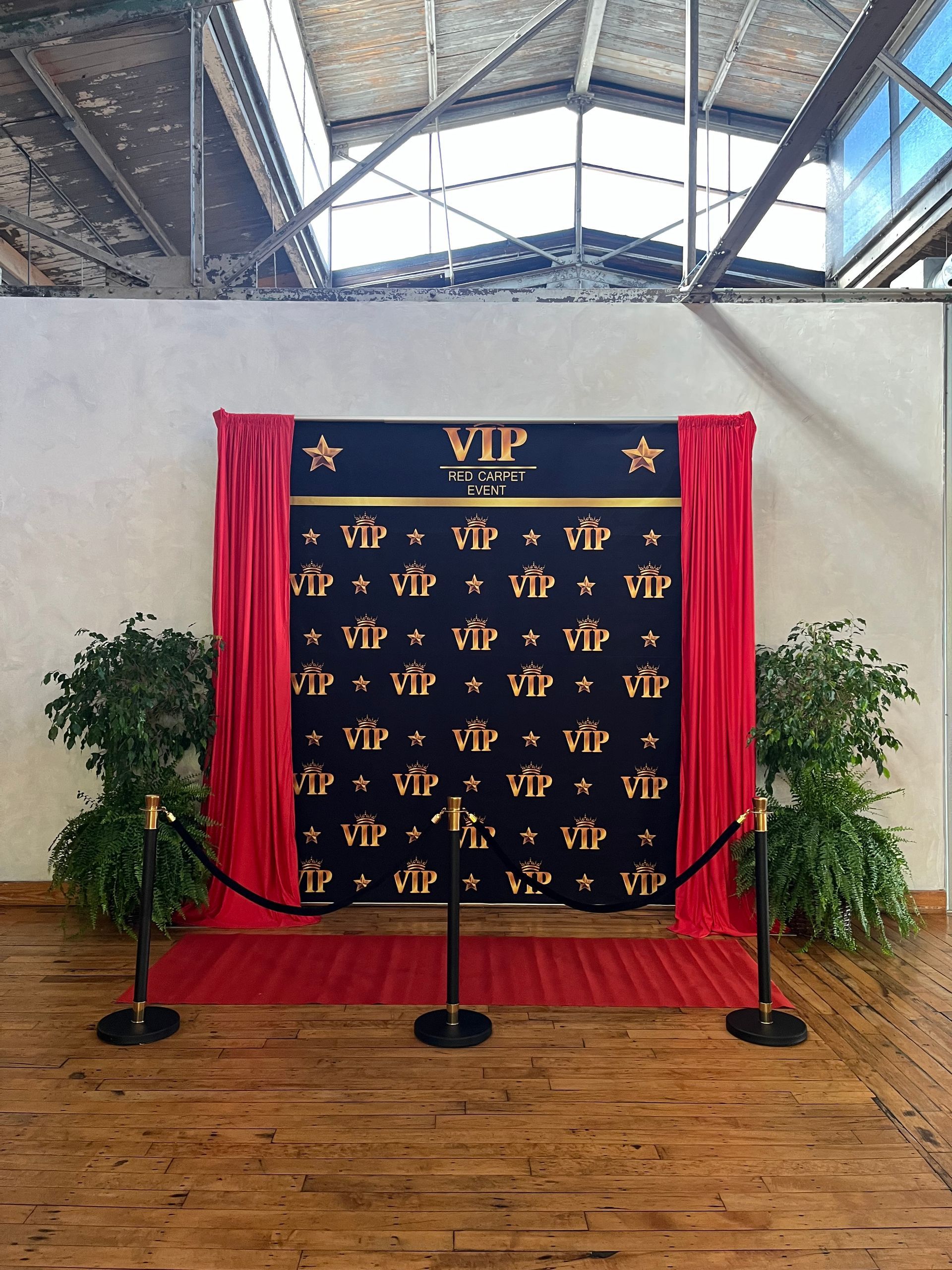 A black and gold backdrop with the word vip on it