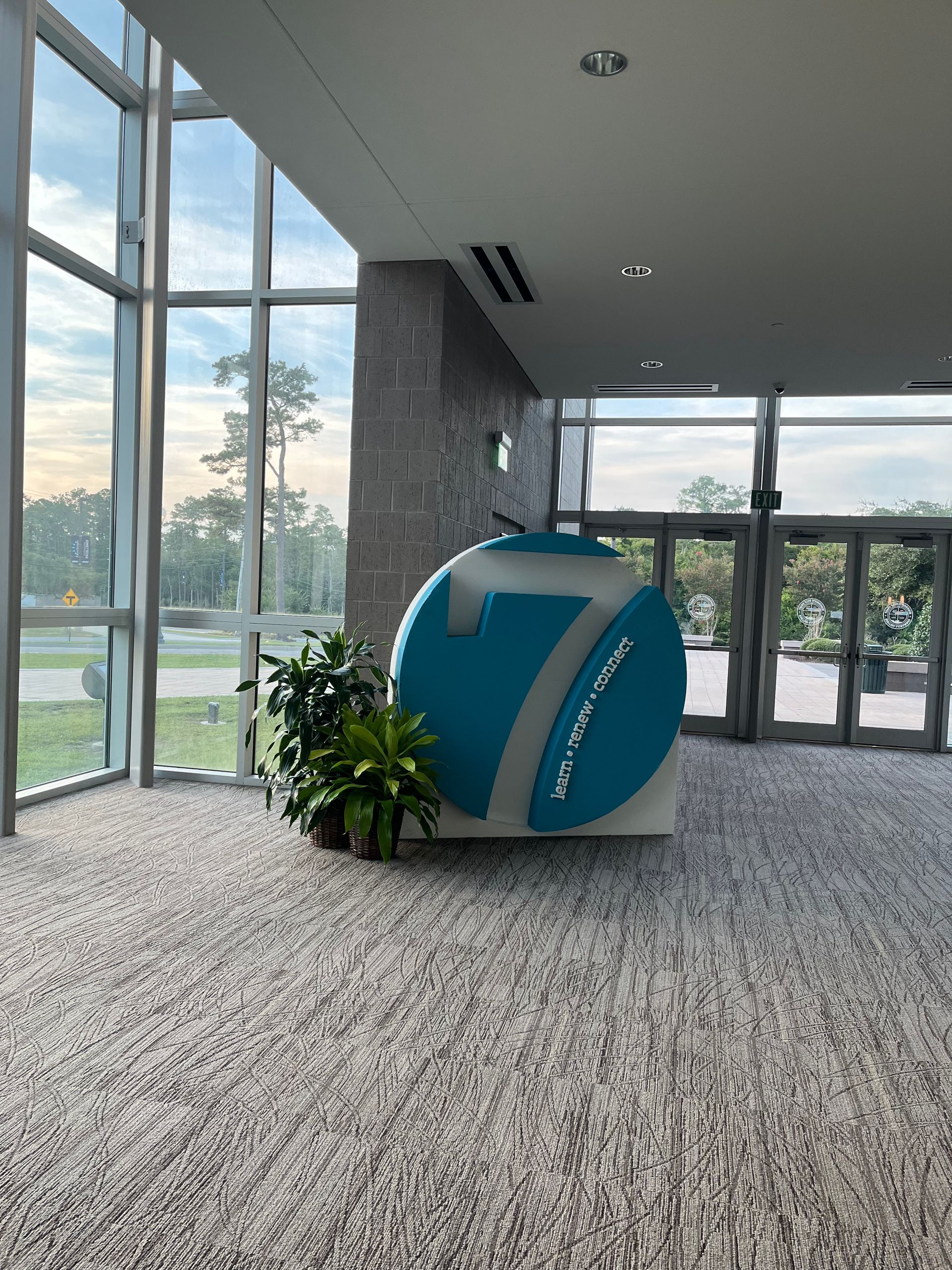 A lobby with a sign that says 7 on it