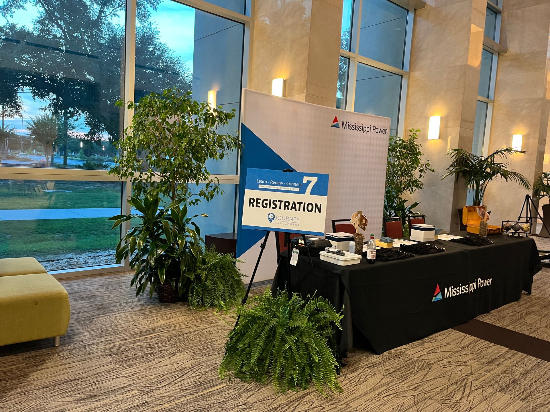 A room with a table and a sign that says registration 7