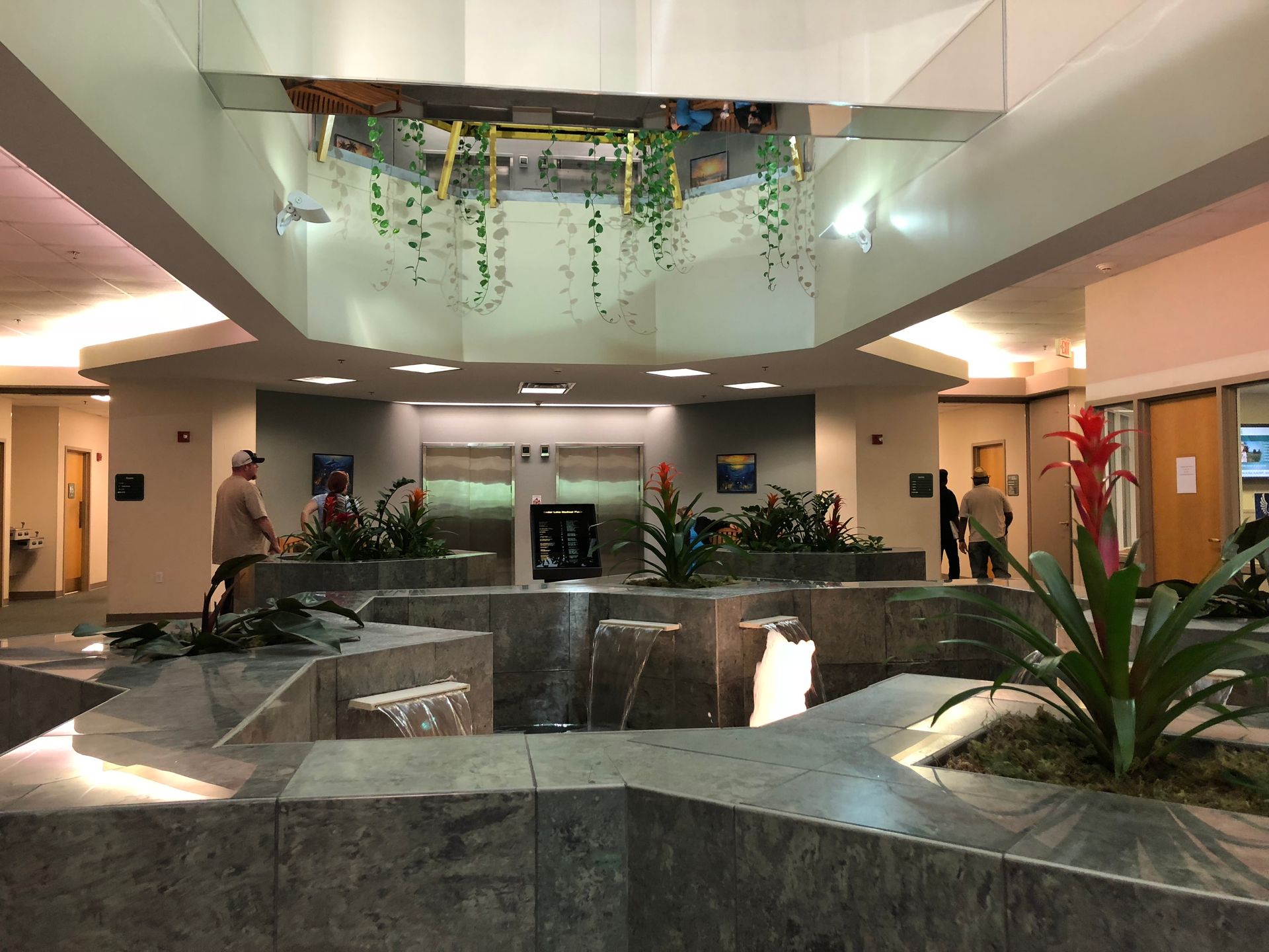 A building with a waterfall in the middle of it