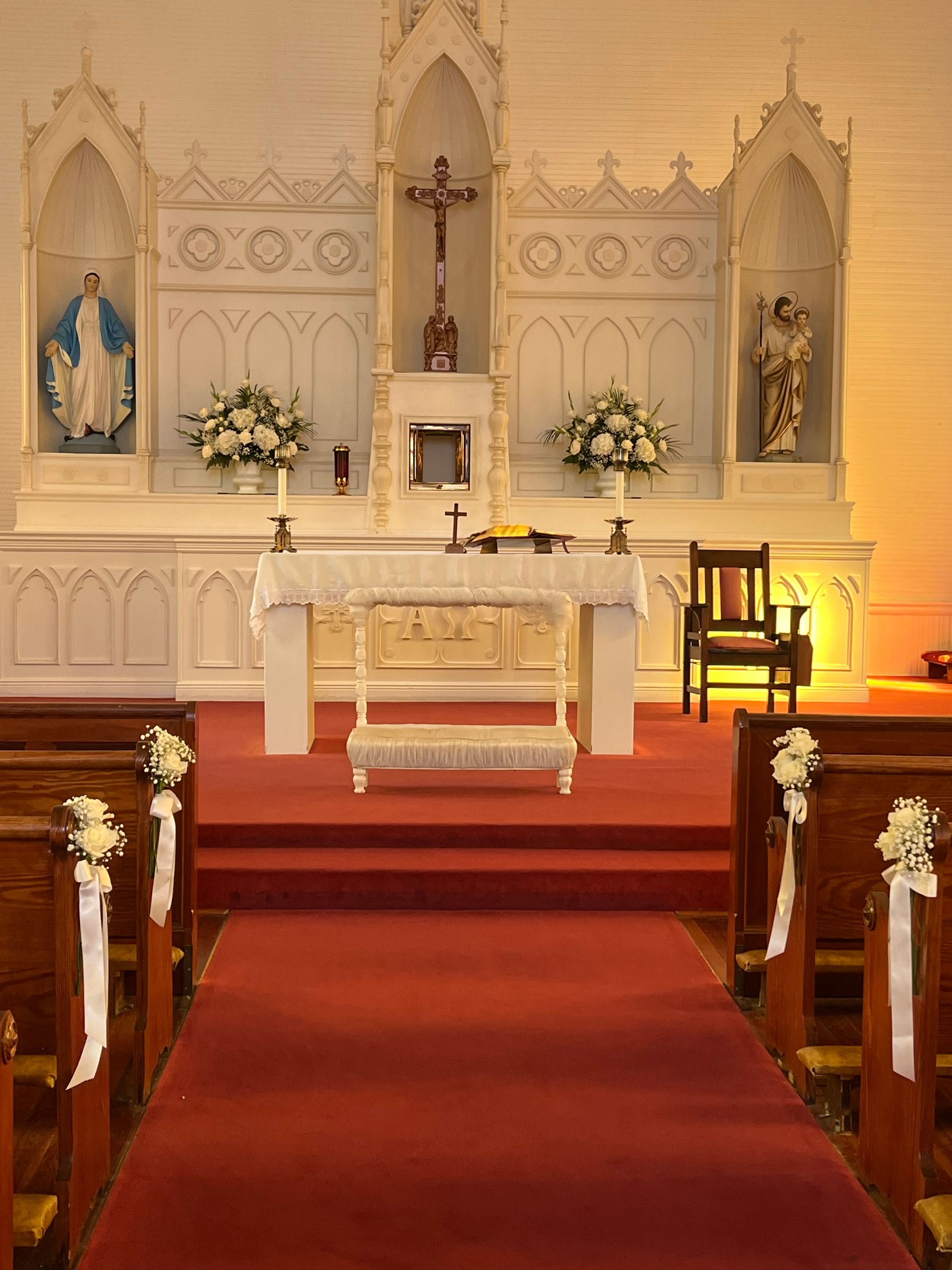 A church with a red carpet leading to the altar