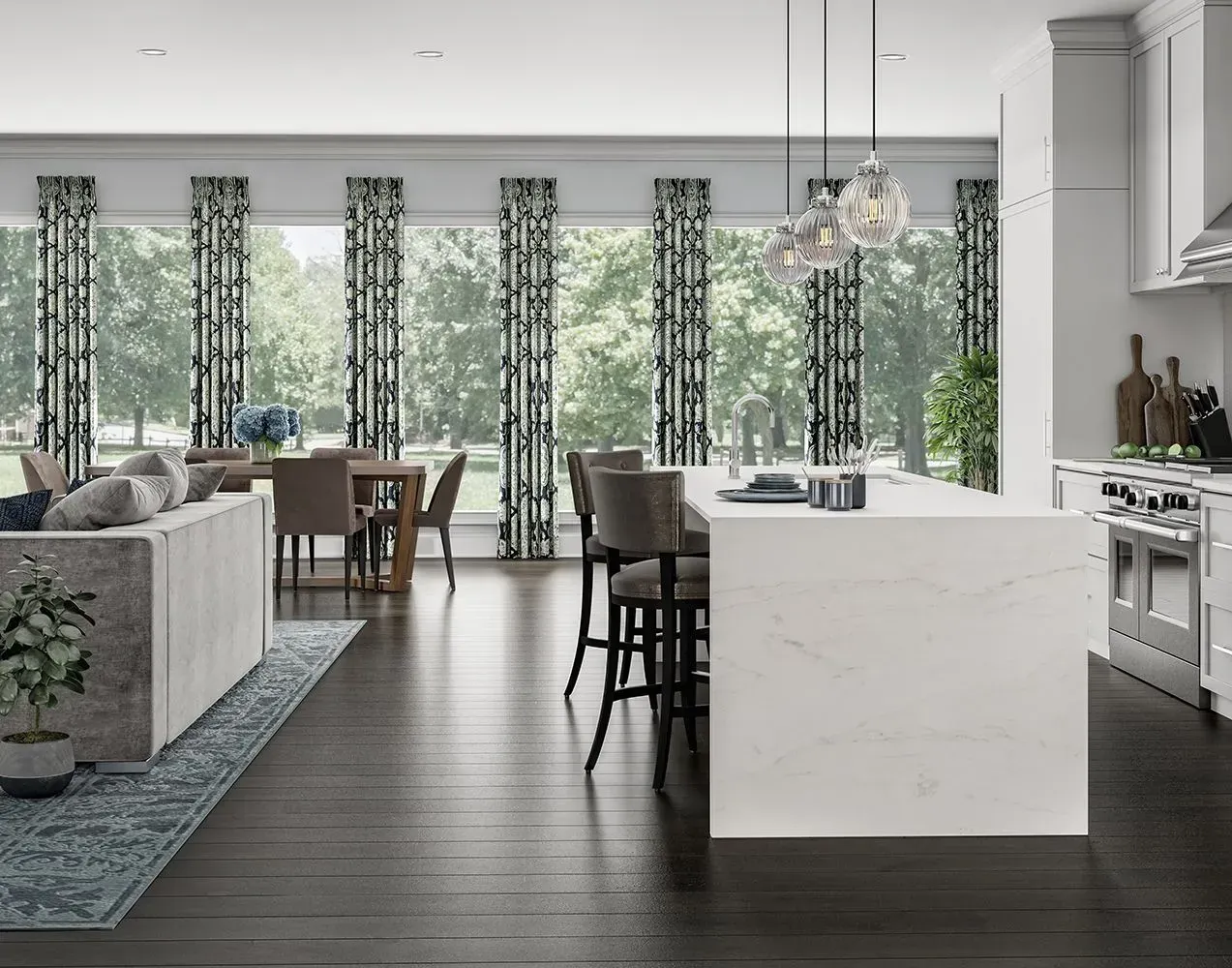 Open-concept kitchen and dining area with dark wood floors, white island, and large windows with patterned curtains.