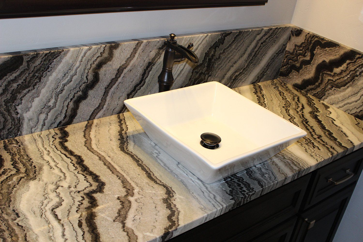 bathroom sink with marble designed countertop