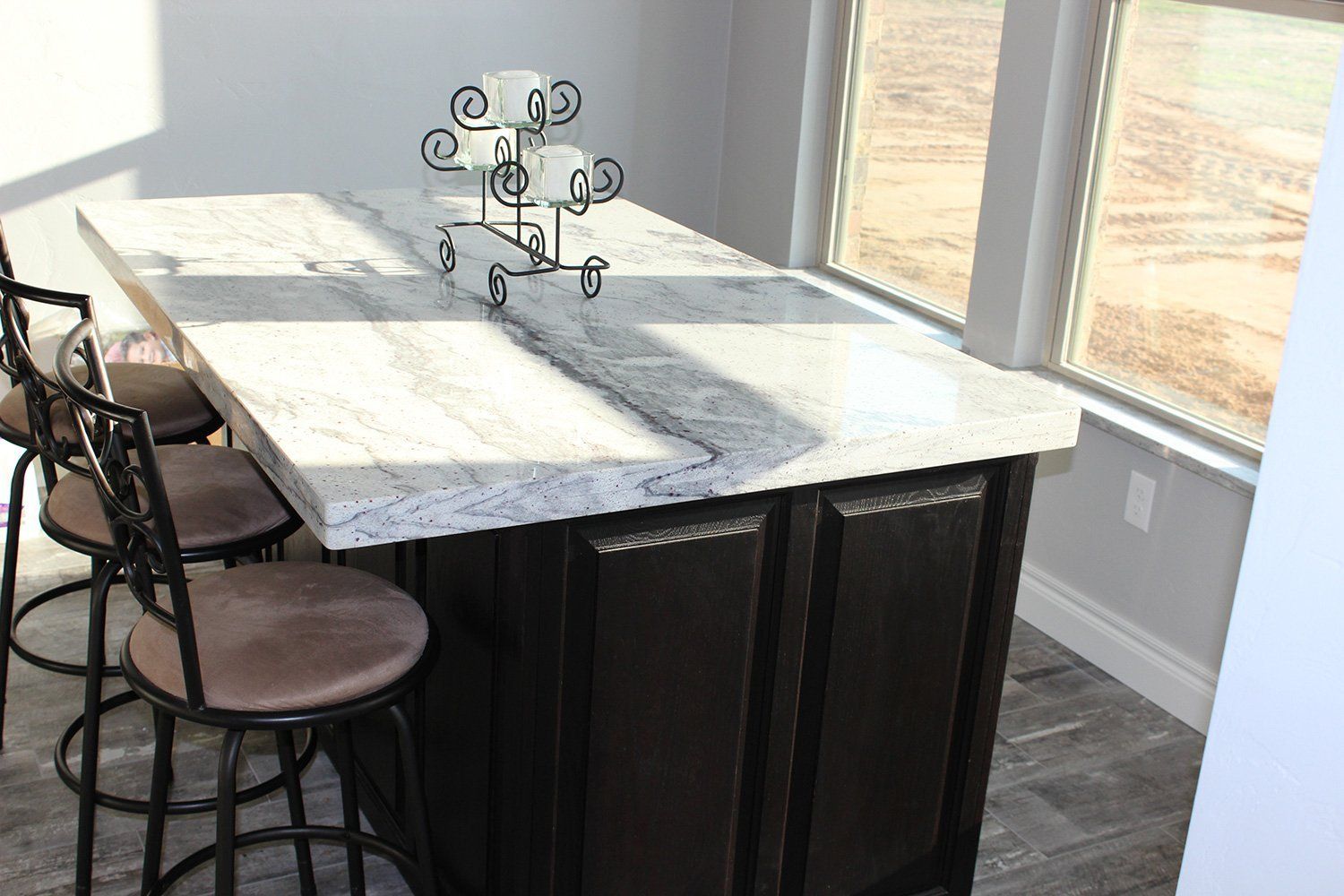 beautiful decorated countertop with chairs