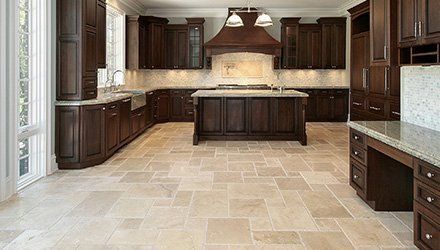 tiled floor of a modern and clean kitchen