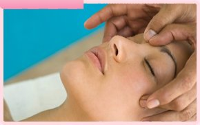 A lady having her head massaged