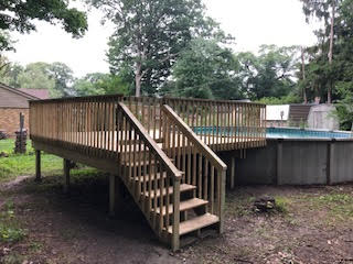 deck with railings and stairs