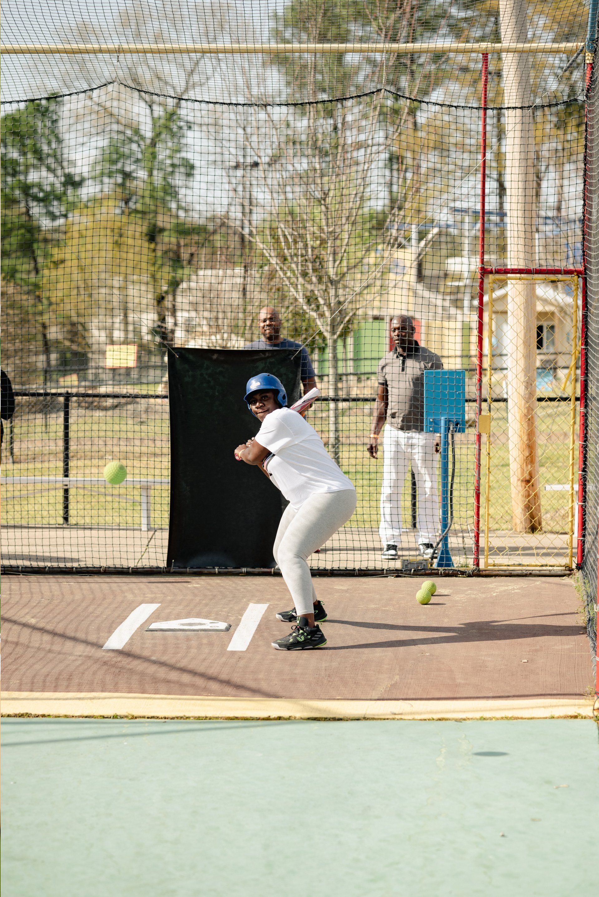 Kid with White Shirt Batting Cage