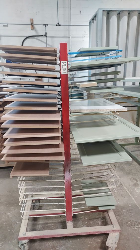 A rack filled with lots of wooden boards in a factory