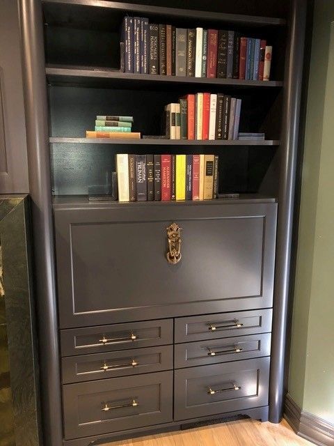 A bookcase with lots of books on it