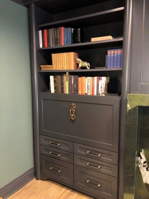 A bookcase with lots of books on it