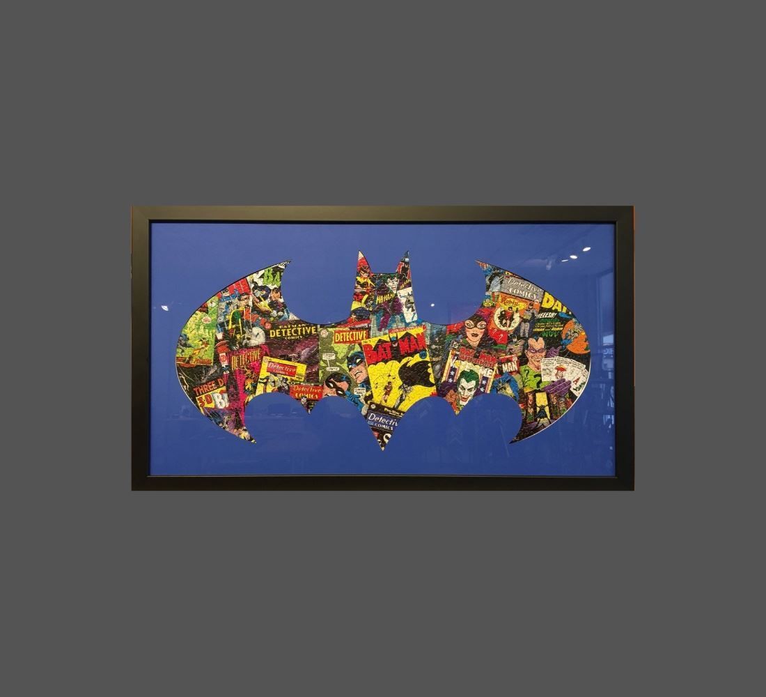 A picture of a batman logo made out of comic books