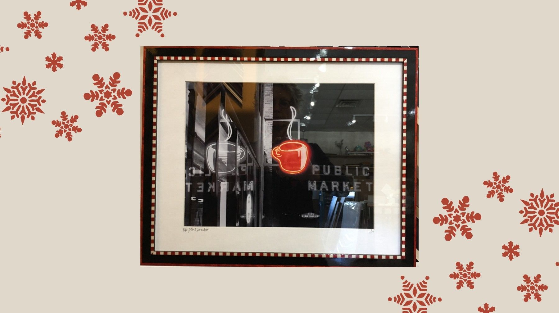 A picture of a public market is framed on a wall