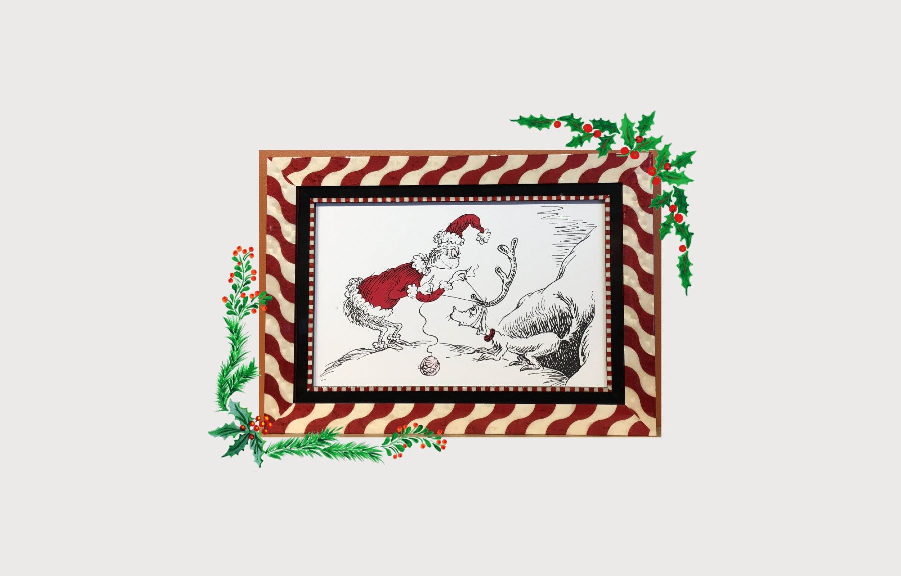 A cross stitch pattern of santa claus and his reindeer in a frame.