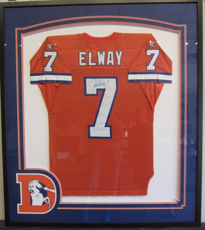 A framed jersey with the name elway on it
