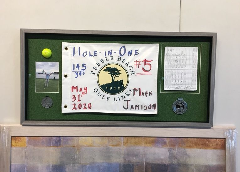 A sign that says hole in one on it