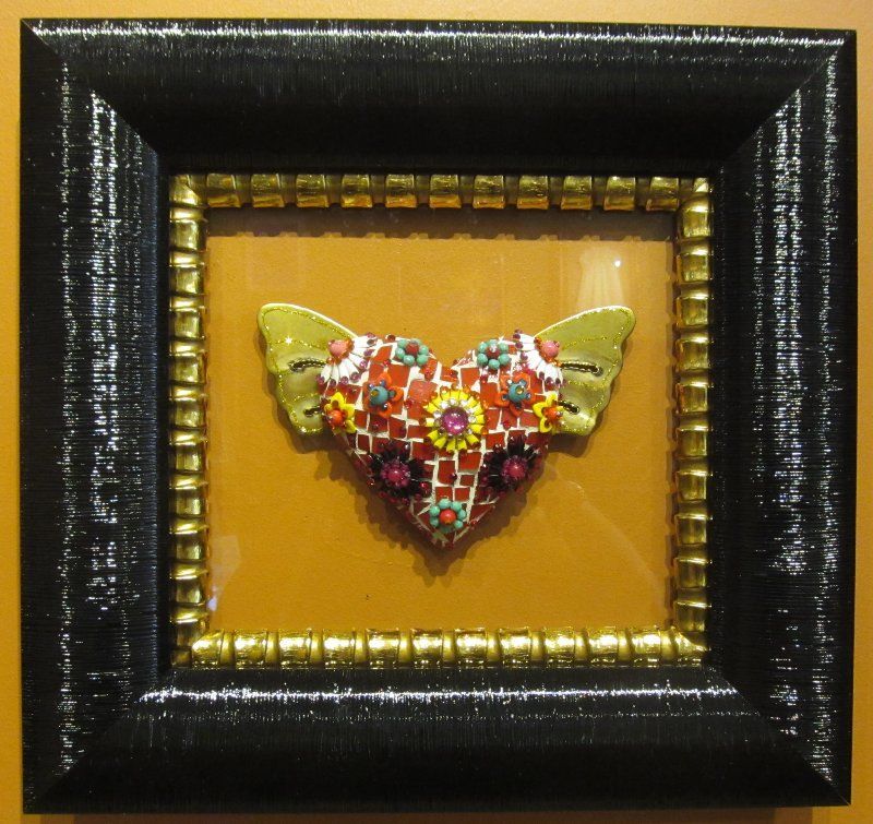 A picture of a butterfly in a black frame
