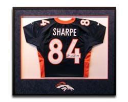 A framed football jersey with the name sharpe 84 on it.