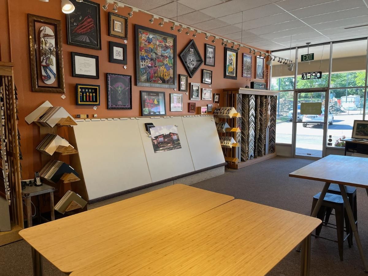 A room with tables and pictures on the wall
