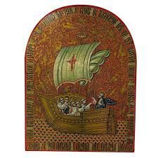 An ornate icon depicting a golden ship with a pale green sail on a dark red background, surrounded by decorative text.