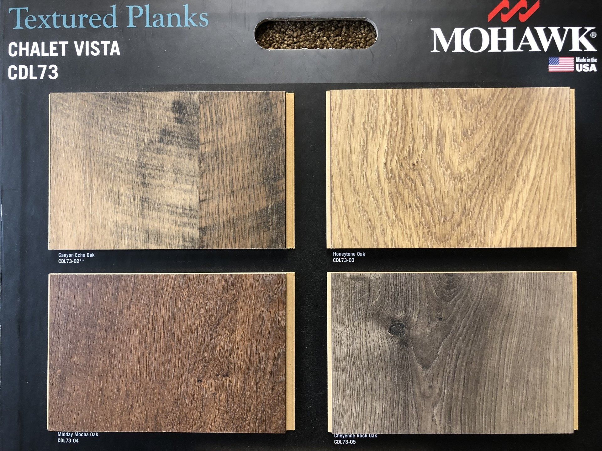 A display of mohawk textured plank chalet vista cdl73