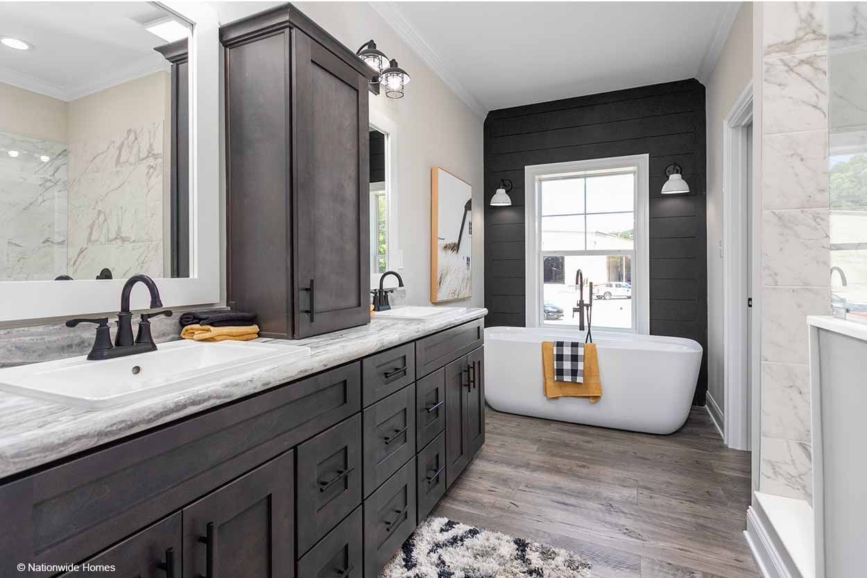 A bathroom with two sinks and a bathtub.