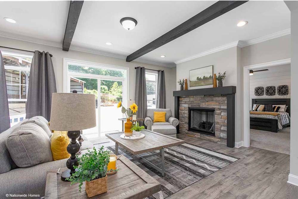 A living room filled with furniture and a fireplace.
