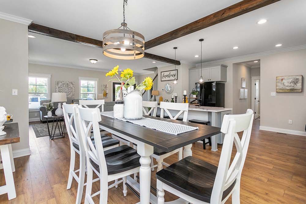 A dining room table and chairs in a house.