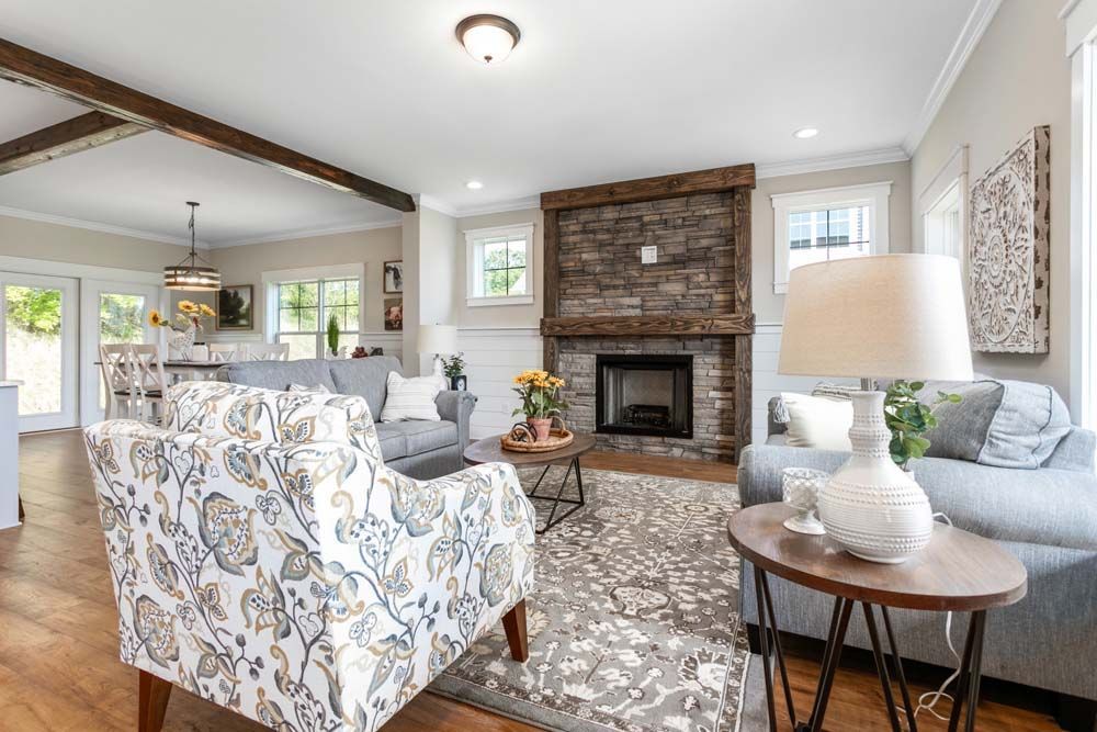 A living room filled with furniture and a fireplace.