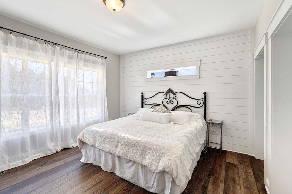 There is a large bed in the middle of the room.