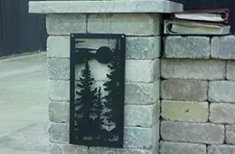 A brick wall with a sign on it and a book on top of it.