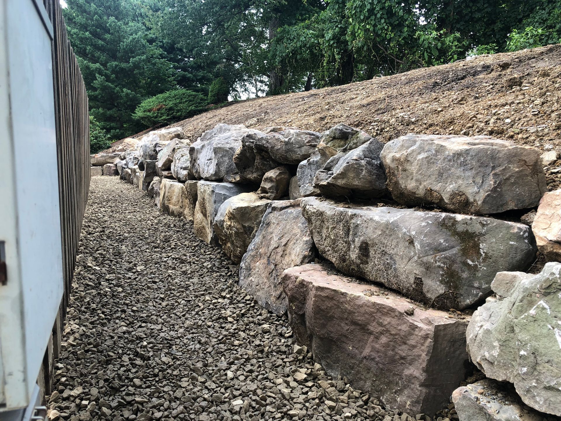 A pile of rocks sitting on top of a dirt hill.