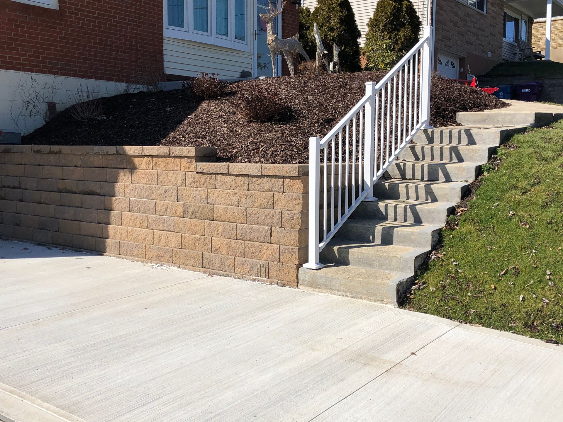 Stairs leading up to a house with a white railing