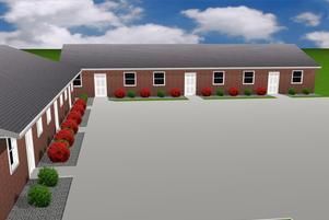 L-shaped, single-story red brick apartment complex with white doors, dark gray roofs, and red bushes in front.