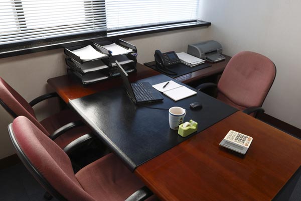 a small conference room with a table and chairs