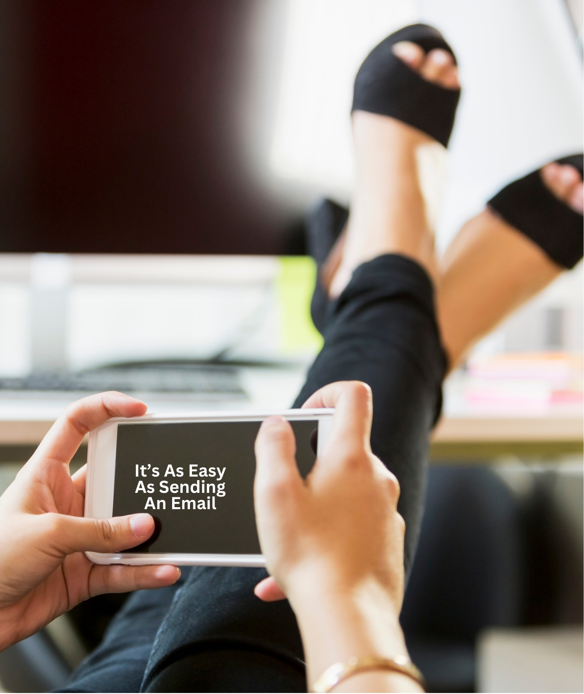 A person is holding a cell phone that says it's as easy as sending an email