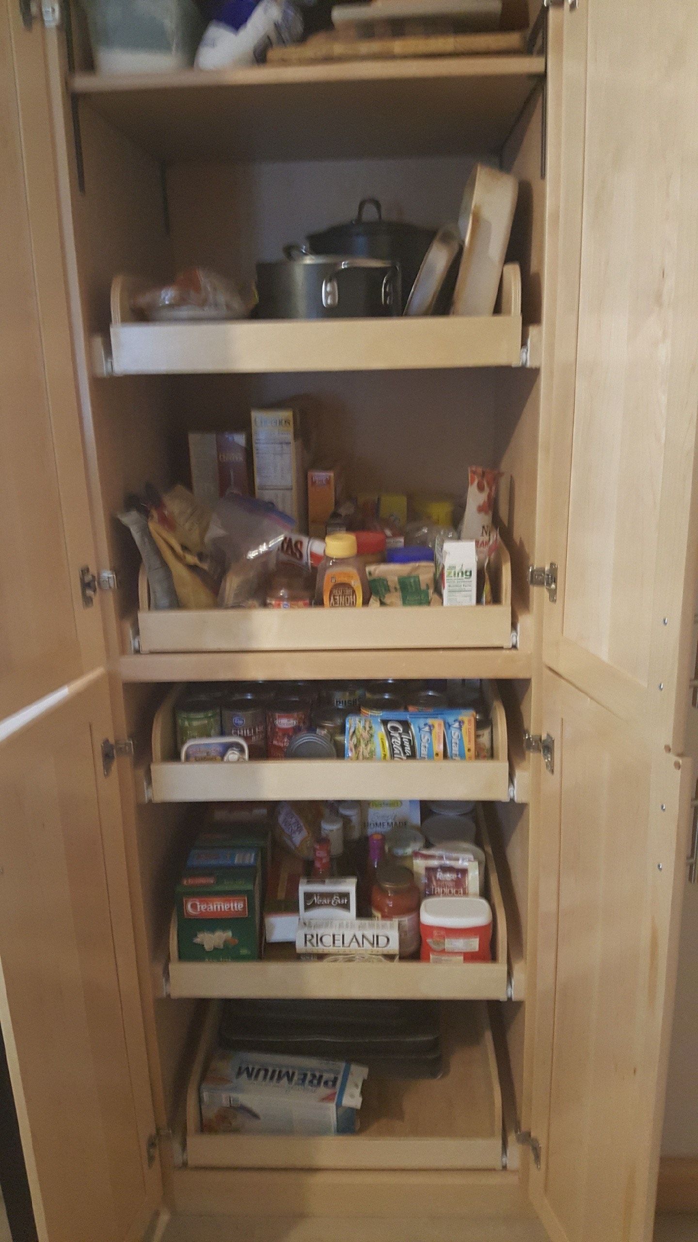 A pantry filled with lots of food and drinks.