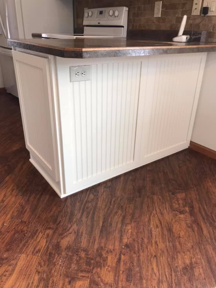 A kitchen island with a telephone on top of it.