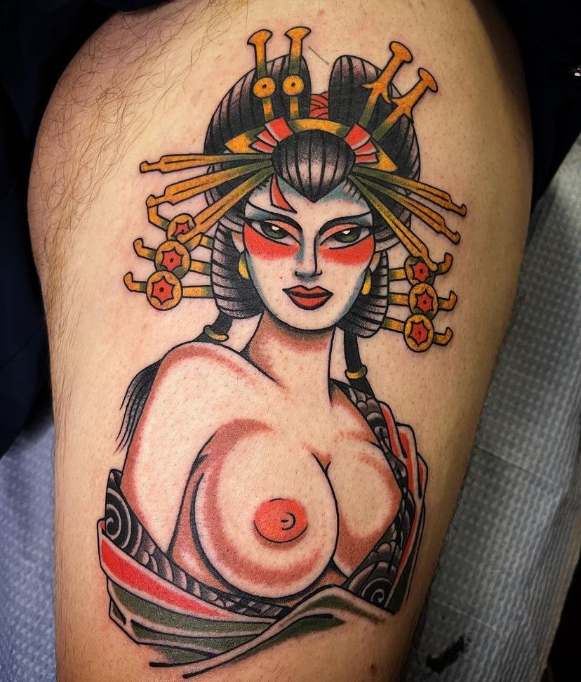 a tattoo of a woman with a headdress