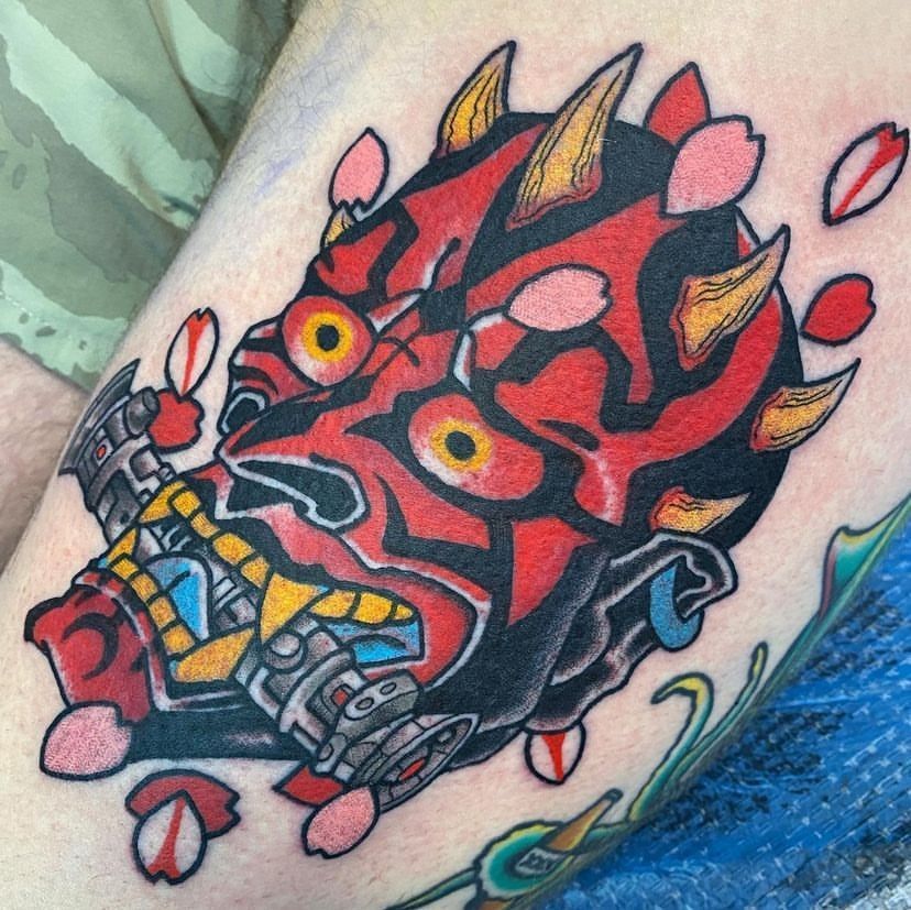 a person has a tattoo of darth maul from star wars on their leg