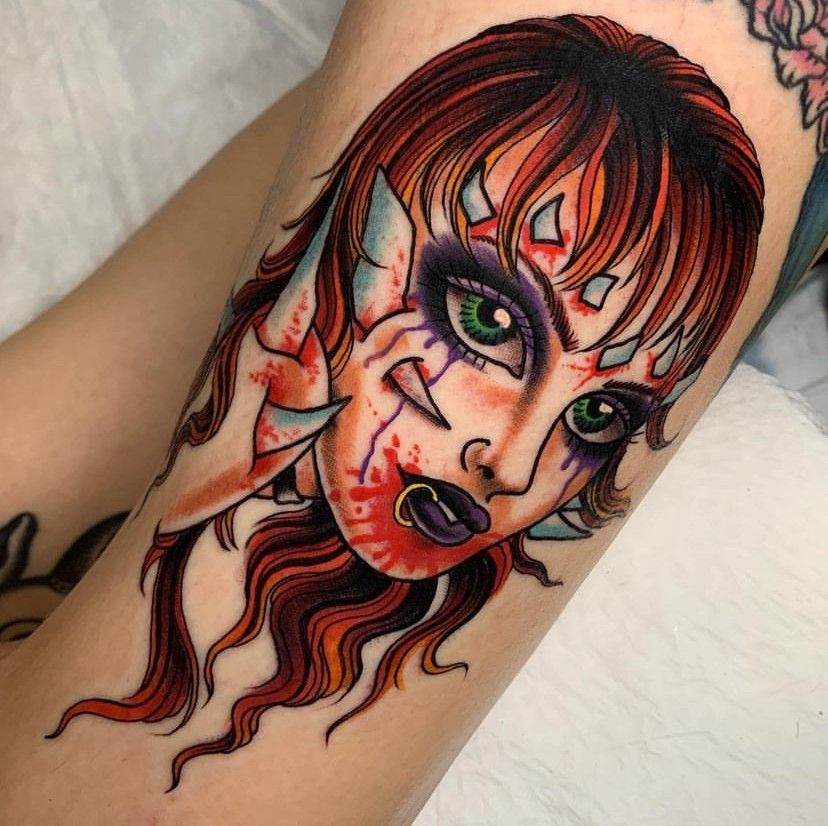 a close up of a tattoo of a woman's face