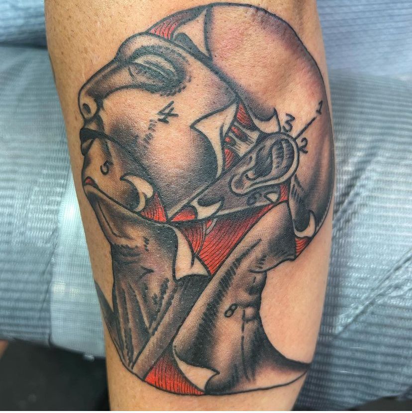 a tattoo of a woman's face with the number 3 on it