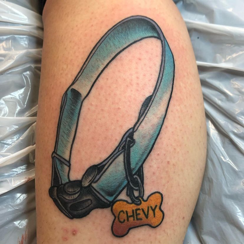 a tattoo of a dog collar with a tag that says chevy