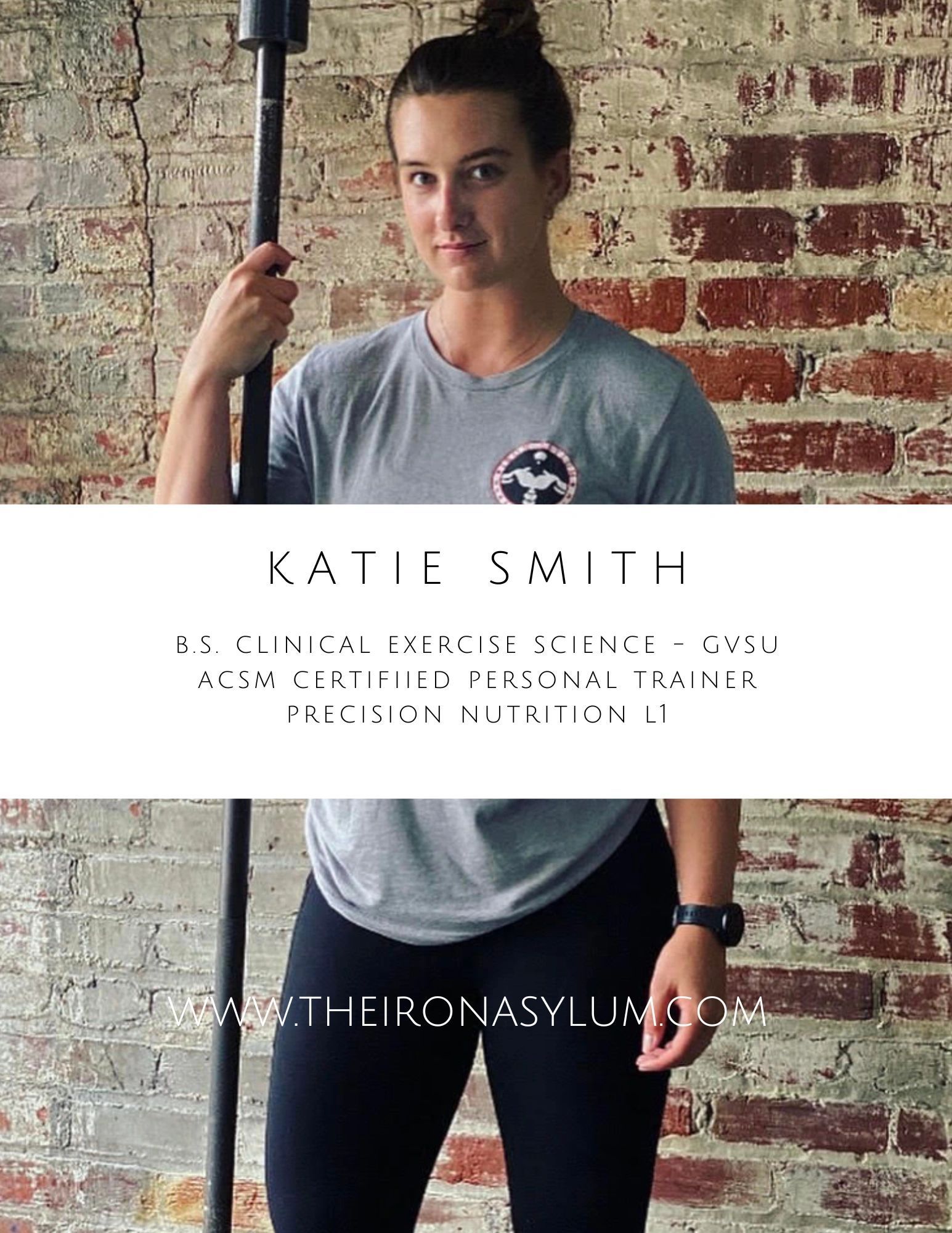 A woman is holding a barbell in front of a brick wall.
